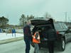Orland Township Supervisor Paul O'Grady loads cars with prepared meals with the help of students from Andrew and Sandburg high schools.