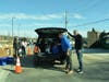 Orland Township Supervisor Paul O’Grady (right) and Township Trustee John Lynch load a resident’s vehicle with prepared meals and pantry staples at the Township’s March Grab & Go meal distribution drive-thru.  