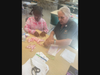 United Women in Faith assembling Breast Cancer Awareness Pins