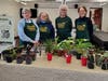 Photo 2: Sally Brockett, Barbara Feinberg, Mary Anne Hardy, and Mary Ellen Proto display plants to share with others.