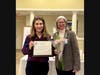 Dr. Samantha Gross accepts the Advancing the Status of Women Award for Bucks County Community College from Jenny Lichtner, SIIR president.
