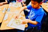 Maple Hill Elementary fifth graders learn visual art techniques during Arts in Action ceramics lesson. 