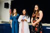 PLTW teachers present awards of achievement during the White Coat Ceremony held on April 23. 