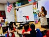 C.J. Morris kindergarten teacher Kelly Revells reads “The Kissing Hand” families on the first day of school. 