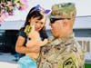 Kindergartner Hannah Cordova surprised by dad's return from Afghanistan during assembly on August 26. 