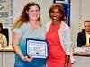 Standout parent volunteer Heather Hoover receives Partner in Education Award. Shown with Board President Helen Hall. 