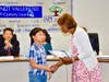 Board President Helen Hall presents Quail Summit fifth grader Arthy Chaisakulchai with the Super Star Student Award on Oct. 16. 