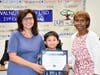 Quail Summit fifth grader Arthy Chaisakulchai with the Super Star Student Award on Oct. 16. Shown with Principal Frances Weissenberger and Board President Helen Hall.