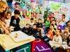 Westhoff Elementary kindergartners test “The Three Little Pigs” structure designs with teacher Roxanne Dennen on November 1. 