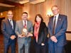 Personnel Commissioners Ray McMullen, Michael Cobarrubias, and Gayle Pacheco celebrate Classified Employee of the Year, Louie Del Real.