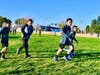 Walnut Elementary 100 Mile Club members sprint, jog, and walk laps on Feb. 27