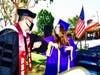 Diamond Bar High Principal Dr. Reuben Jones celebrates graduates with social distancing elbow bump during 37th commencement. 