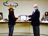 Board President Larry Redinger presents Partner in Education Award to Vejar parent Helen Chung. 