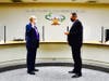 Superintendent Dr. Robert Taylor administers oath of office to Larry Redinger on Dec. 14.