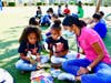 Westhoff ELS Therapi Kaplan offers support to young readers during the Nov. 5 reading party. 