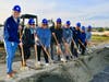 We Dig It! Walnut High coaches and staff assemble with shovels and hard hats during the gymnasium groundbreaking ceremony.