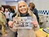 Proud Alumna! Walnut Valley USD Public Information Specialist with her sixth grade class photo on display at Castle Rock’s 60th anniversary celebration. 