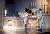 Bishop Caggiano blesses the Altar with Holy Water
