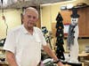 Covenant Living of Northbrook resident Fred Lafnitzegger shows off some of the handcrafted wooded items that will be on sale at Merry Market. 