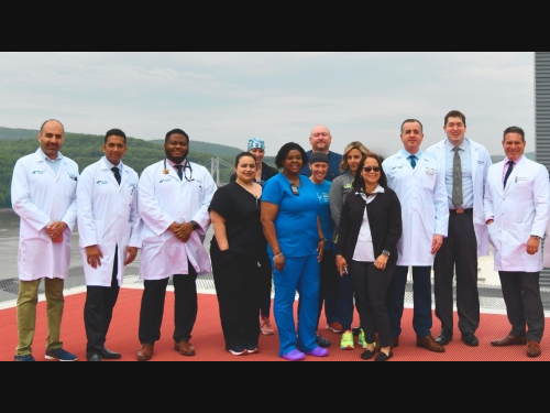 Members of the Vassar Brothers Medical Center stroke team outside on the helipad of the hospital.