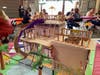 Khloe Wright created a multi-level Dream Home with balconies, porch, window boxes, a water slide leading to a pool below and other features.
 
