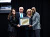Michael Crome (far right), Raiders CFO, accepts the JA Gold Leadership Award from Jack Kosakowski, Junior Achievement USA; Michelle Jackson, Junior Achievement of Southern Nevada; and Jan Jones Blackhurst, event keynote speaker.
