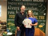 Nate Lloyd and his ex-wife Jamie Lloyd with all the Golden Ticket Raffle winner-take-all prize certificates covering a variety of sports, vacation and entertainment packages and other items. 