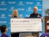Kelly Simonson (left), CEO of UnitedHealthcare Health Plan of Nevada Medicaid, presents a $140,000 check to Andy Bischel, president and CEO of Boys & Girls of Southern Nevada, that will fund scholarships for 50 kids to benefit from Club programming. 
