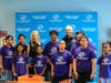Kelly Simonson, CEO of UnitedHealthcare Health Plan of Nevada Medicaid, and Andy Bischel, president and CEO of Boys & Girls Clubs of Southern Nevada, pose with Club youth following a check presentation ceremony announcing the collaboration.