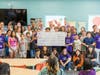 Caesars Entertainment executives present a check to Boys & Girls Clubs of Southern Nevada and Boys & Girls Clubs of America representatives. They are joined by Caesars Entertainment HERO volunteers and Boys & Girls Clubs of Southern Nevada youth.