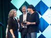 Michelle Jackson, Junior Achievement of Southern Nevada president and CEO, and Nathan Lloyd, JASN board chair, present Danny Koker of Count’s Kustoms and Counting Cars fame with an award for being the Swimming With The Big Fish keynote speaker.