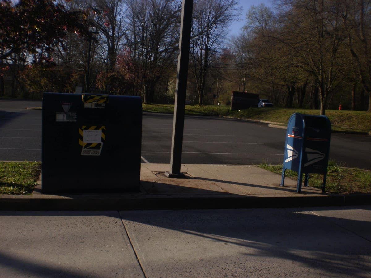 Police are investigating the theft of mail from a mailbox right outside a post office in Newtown.