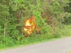 A former Brookfield volunteer firefighter saved the life of a motorist he found trapped inside a burning car.