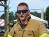 A former Brookfield volunteer firefighter saved the life of a motorist he found trapped inside a burning car.