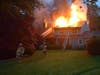 First responders ​reported 'heavy fire' in the rear of the house, in the attic and already through the roof. 