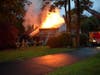 First responders ​reported 'heavy fire' in the rear of the house, in the attic and already through the roof. 