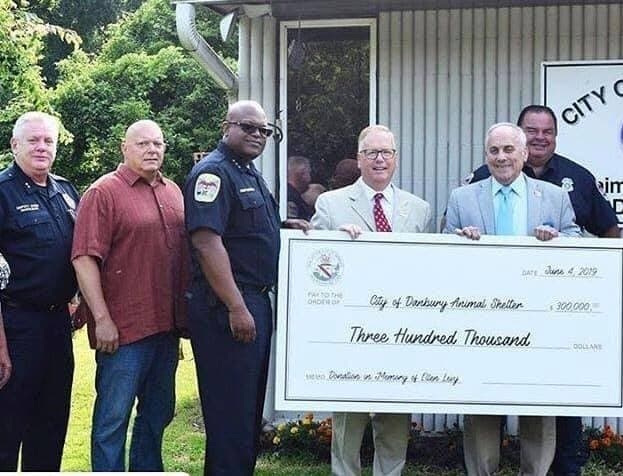 Levy handed over the check to Mayor Mark Boughton in a presentation attended by Police Chief Patrick Ridenhour