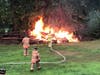 Lightning struck a tree and then traveled down to a large pile of dead trees and brush.