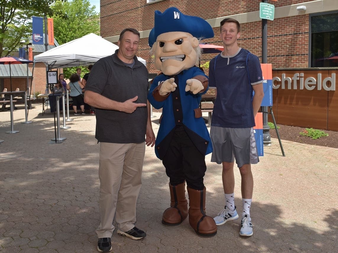 Father and son Doug and Brandon Muckerman with WCSU mascot Colonial Chuck at the university’s summer orientation last month. The New Milford residents are both incoming students this fall.