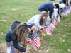 The names of the veterans from the Immaculate family were read and students processed with flags bearing those veterans names to the s