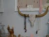 Pendants dangle from the horns of a glittery cattle skull that would do any Santa Fe boutique proud. 