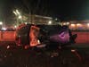 Members of the Danbury Fire Department found the SUV on its side on the grass, and its two occupants injured inside.