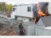 Danbury Fire Department first responders reported heavy smoke and flames showing from the rear of a two-story multi-family building on Bells Place Monday morning.
