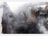 Danbury Fire Department first responders reported heavy smoke and flames showing from the rear of a two-story multi-family building on Bells Place Monday morning.