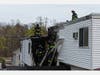Danbury Fire Department first responders reported heavy smoke and flames showing from the rear of a two-story multi-family building on Bells Place Monday morning.