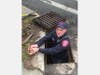 The Danbury firefighters were able to removing the top of the drain and dive in to retrieve the ducklings from the covert pipe.