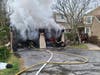 Danbury Fire Department crews battled a large amount of fire from the garage of a 2 ½ story wood frame condo end unit, requiring a third alarm response