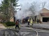 Danbury Fire Department crews battled a large amount of fire from the garage of a 2 ½ story wood frame condo end unit, requiring a third alarm response