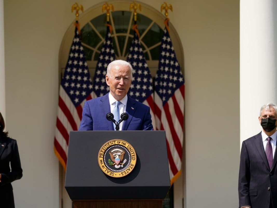 Joe Biden, Kamala Harris and Merrick Garland in the White House Rose Garden.