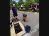 Bethel Officer Ditullio swapped out her uniform boots for rubber waders and took the plunge to rescue a kitten trapped between two storm drains,